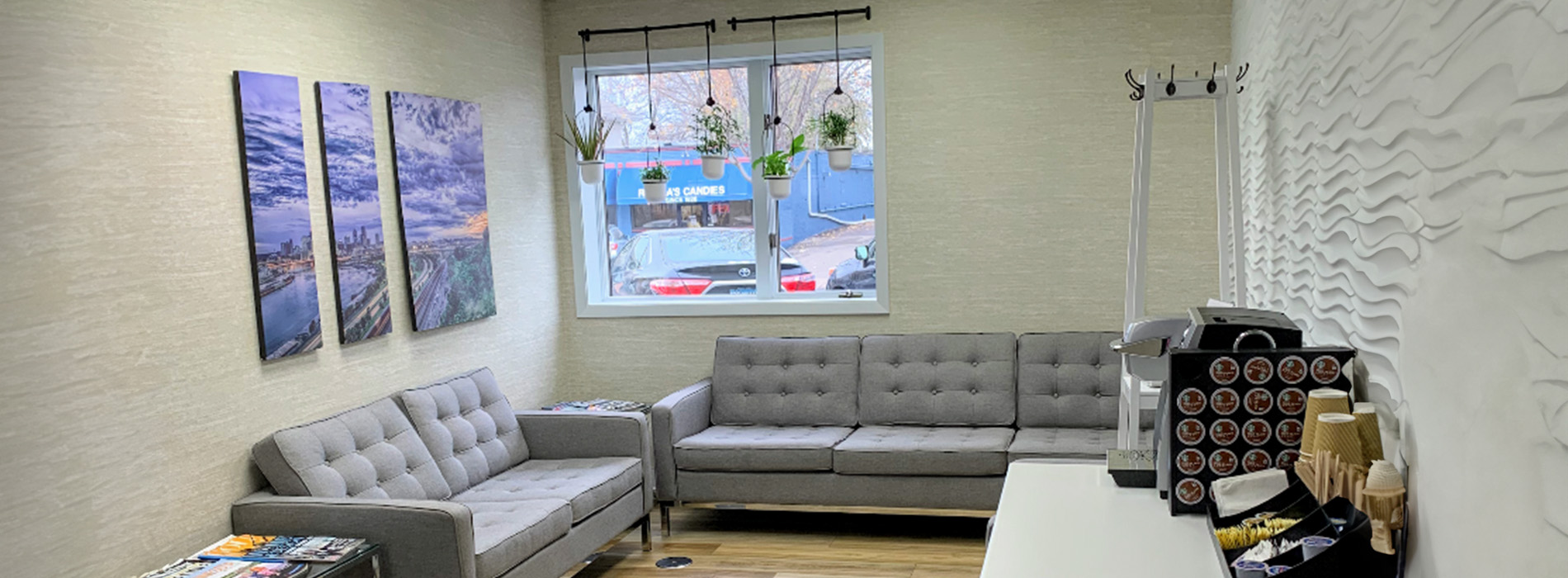 The image shows a modern dental clinic interior with various pieces of equipment, including a dental chair and an X-ray machine.
